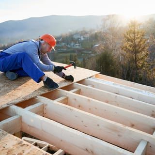 Roof Replacement in Waldport, OR - carpenter installing roof decking