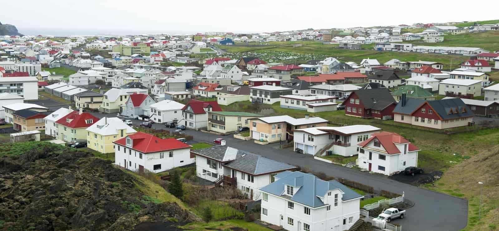 Roof Replacement in Yachats, OR - aerial view of a town of colorful houses