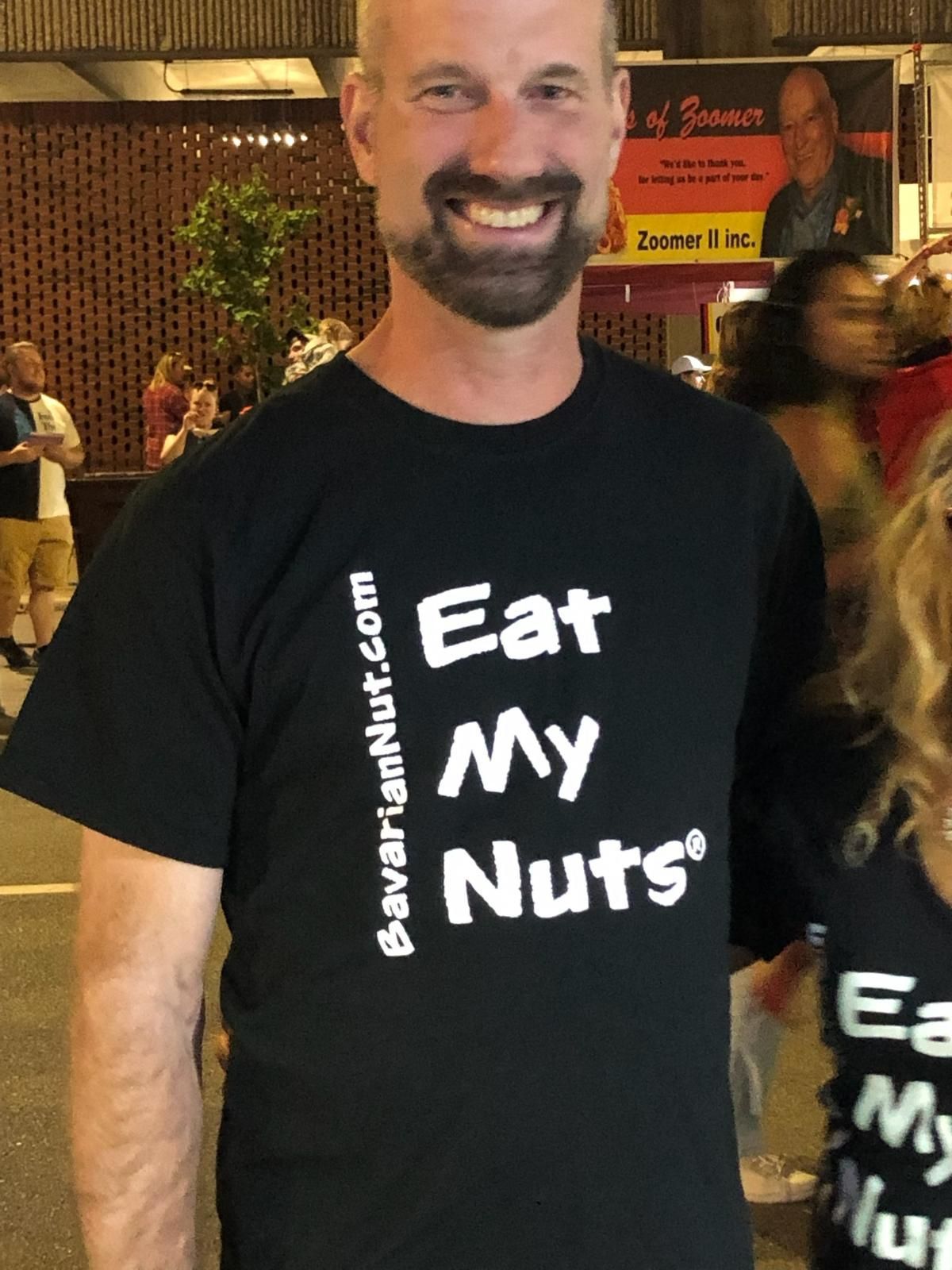 A Man wearing black t-shirt with Eat My Nuts print