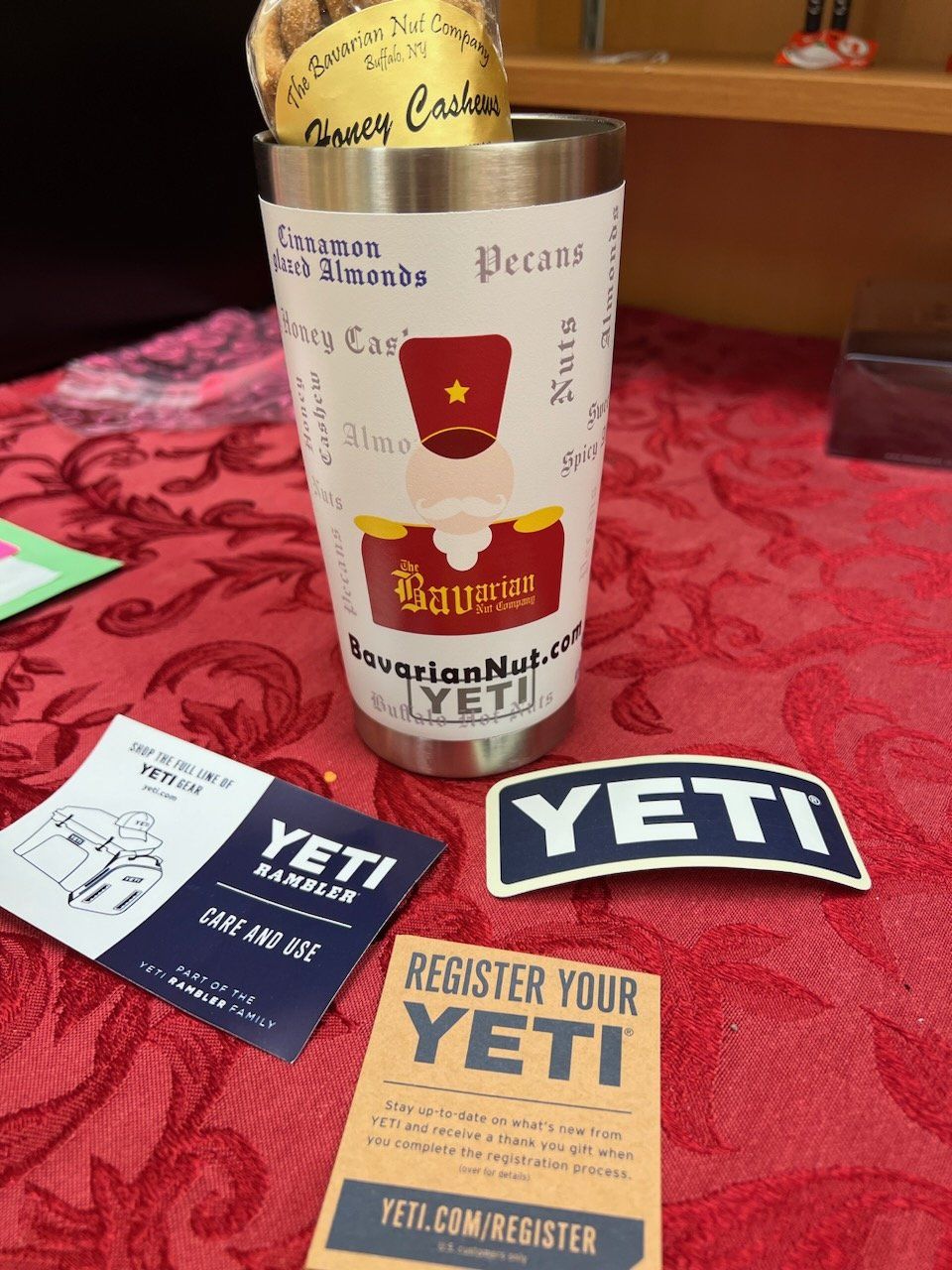 A yeti tumbler is sitting on a red table