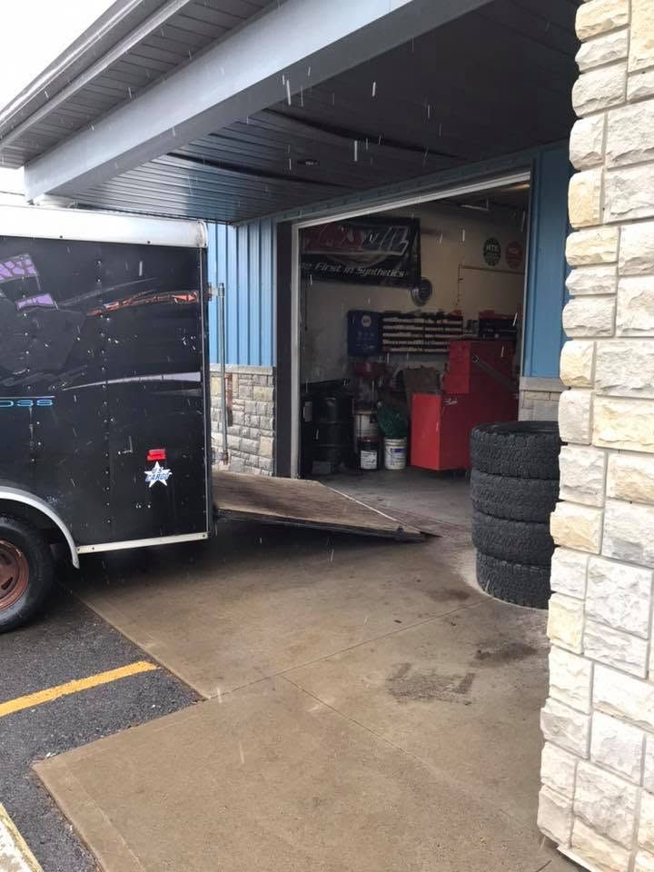 Auto Repair Shop Service Bay With Tires And Equipment | J&T Car Care