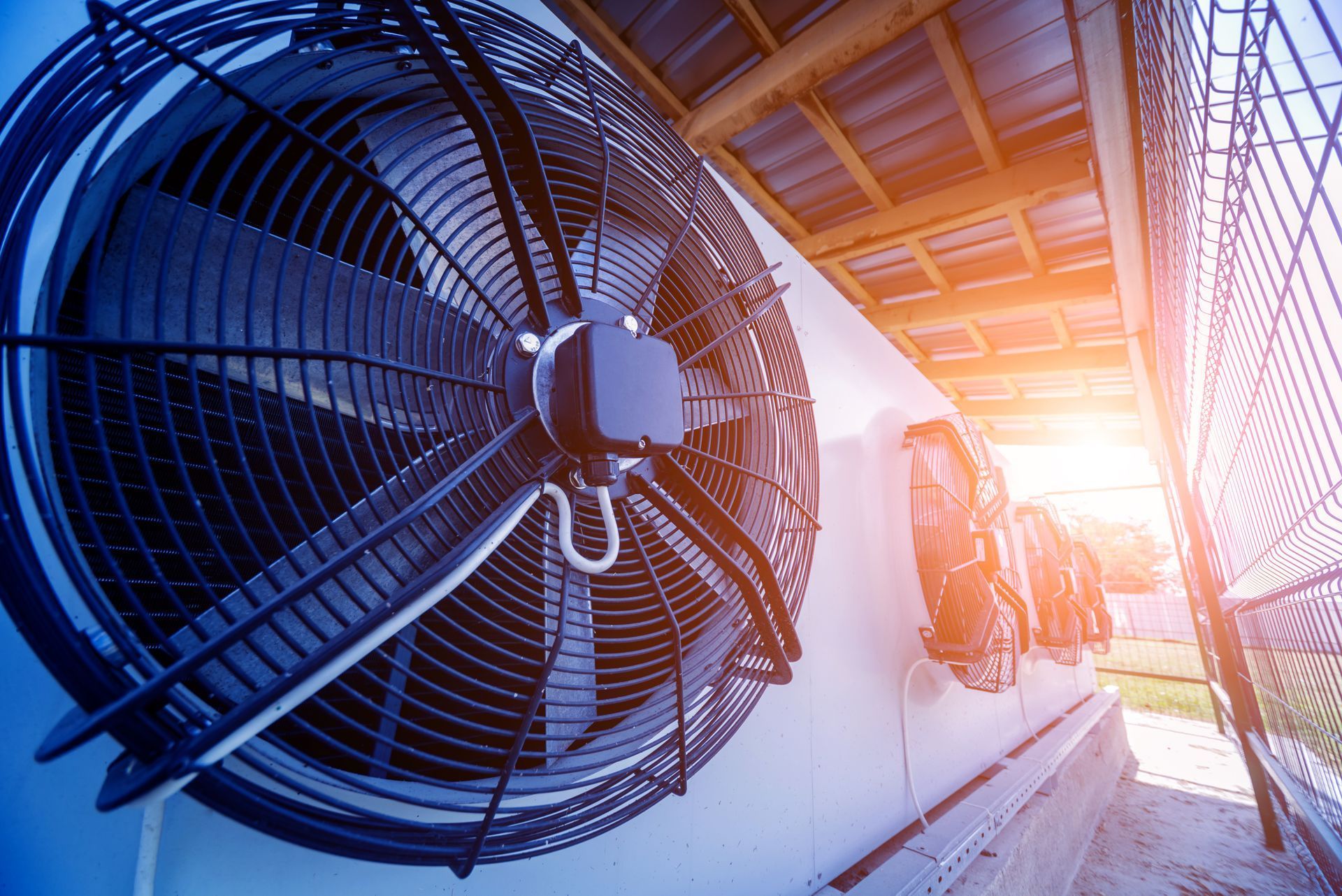 A large fan is hanging from the side of a building.hvac okeechobee
