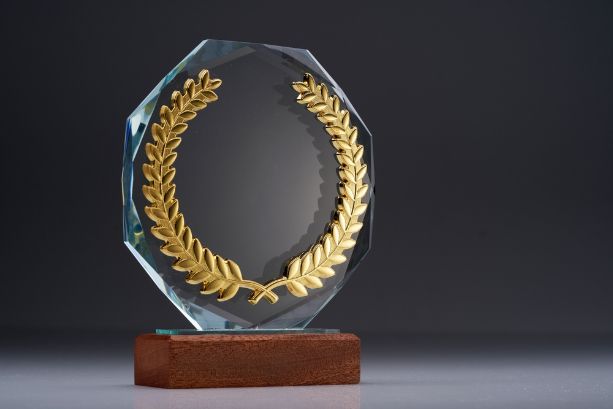 A Glass Trophy with A Gold Laurel Wreath on It — Brookes Engraving & Signs in Wollongong, NSW