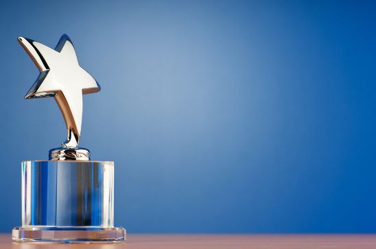 A Trophy with A Star on Top of It Is on A Table — Brookes Engraving & Signs in Wollongong, NSW