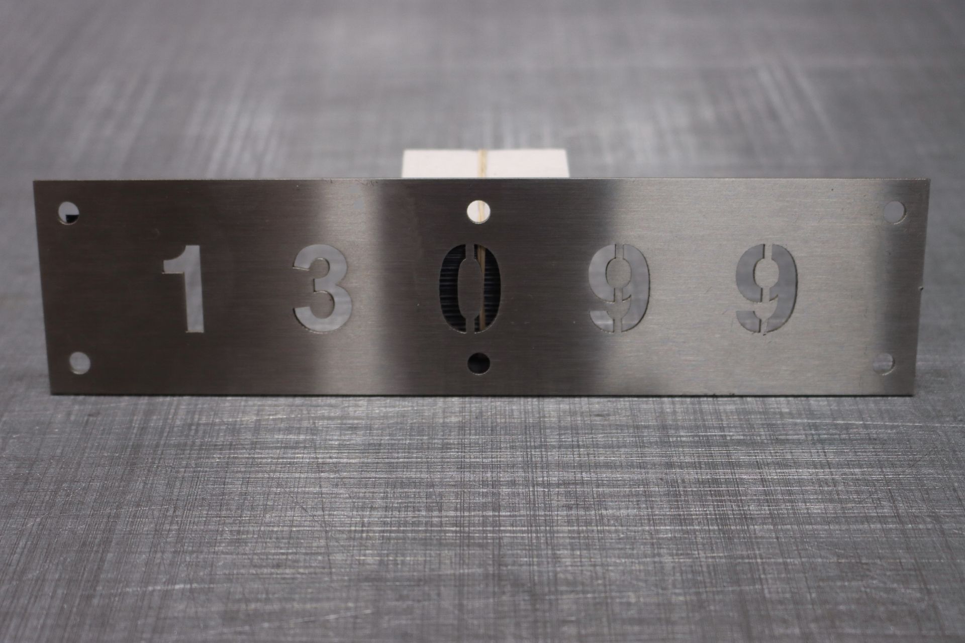 A stainless steel sign with the numbers 1 3 and 9 on it 