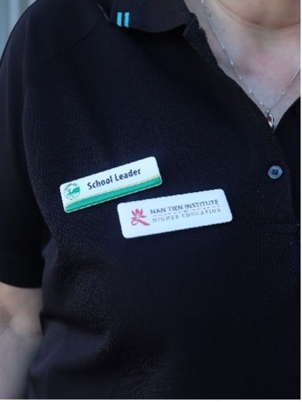 A Woman with some Name Tags