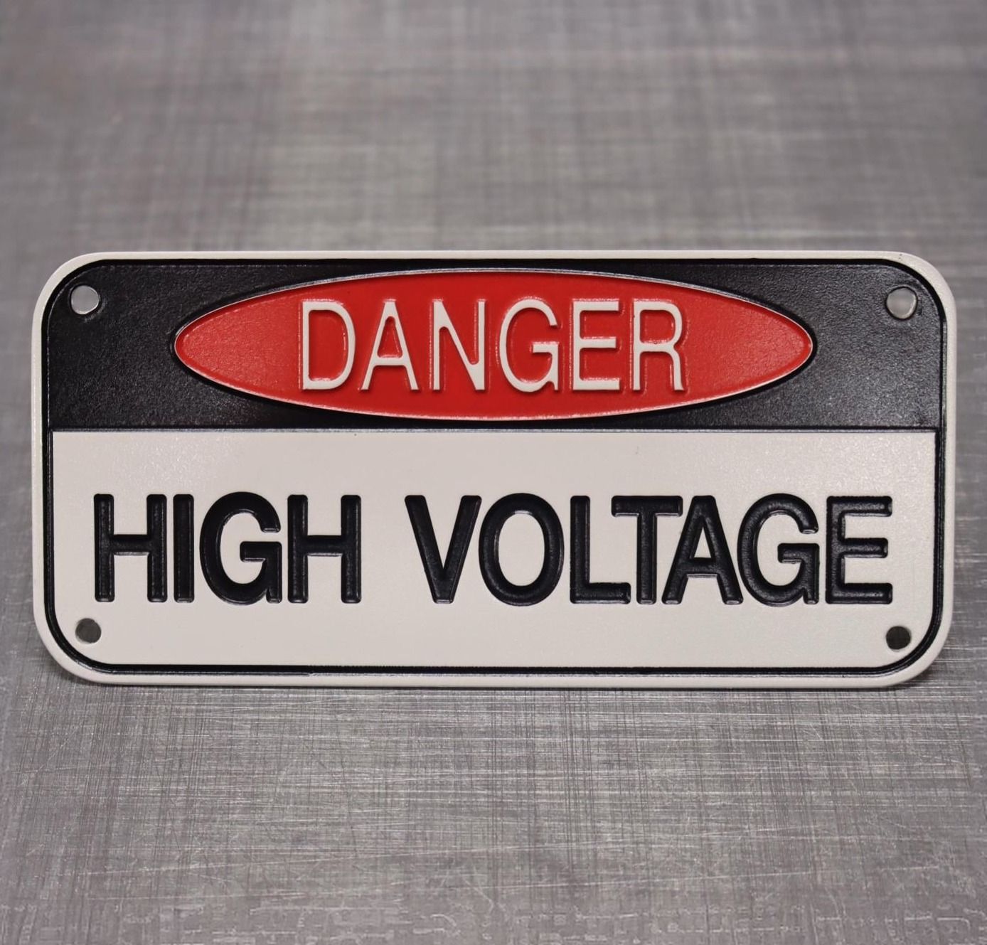 A Danger Sign Warning People to Keep a Safe Distance from The Base of A Sand Dune 