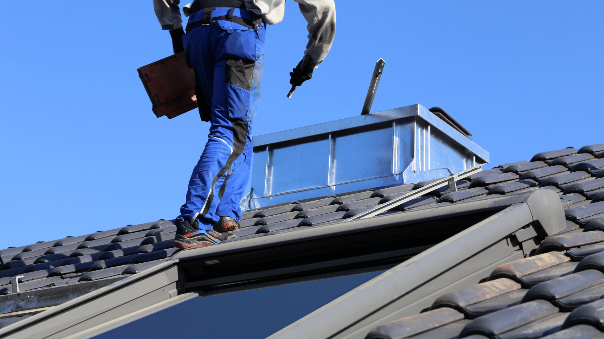 Roofer conducting a scheduled seasonal flat roof inspection