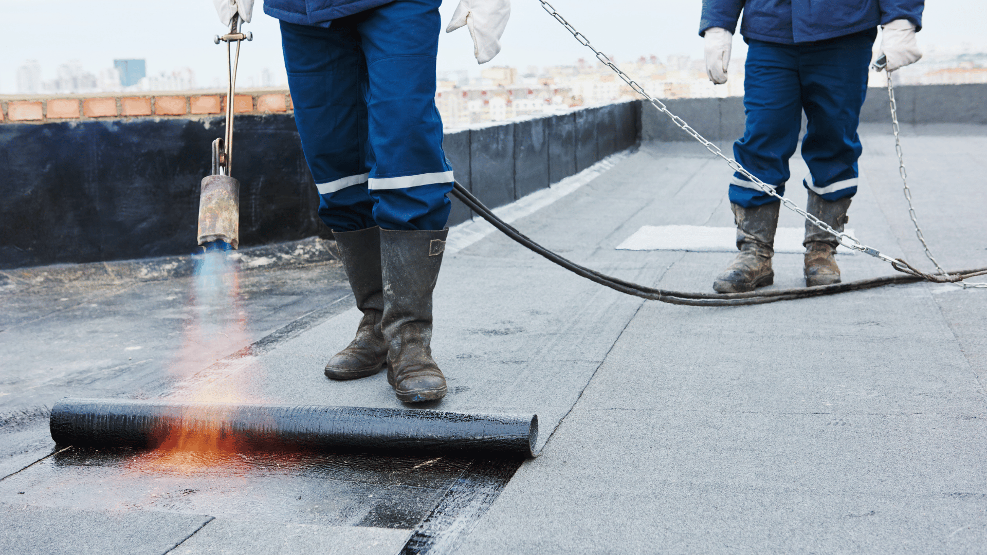 Silicone roof coating being applied to protect against ponding water 