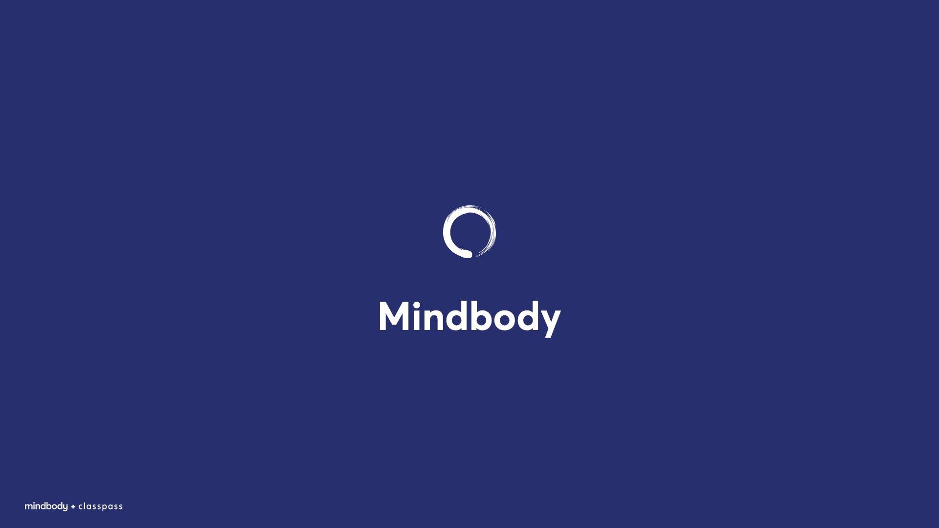 The Mindbody logo: a white, circular brushstroke icon above the text 
