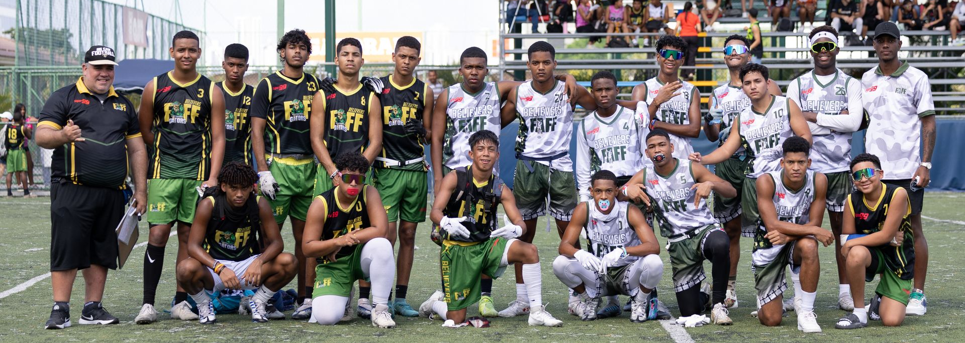 Believers athletes posing together on the field