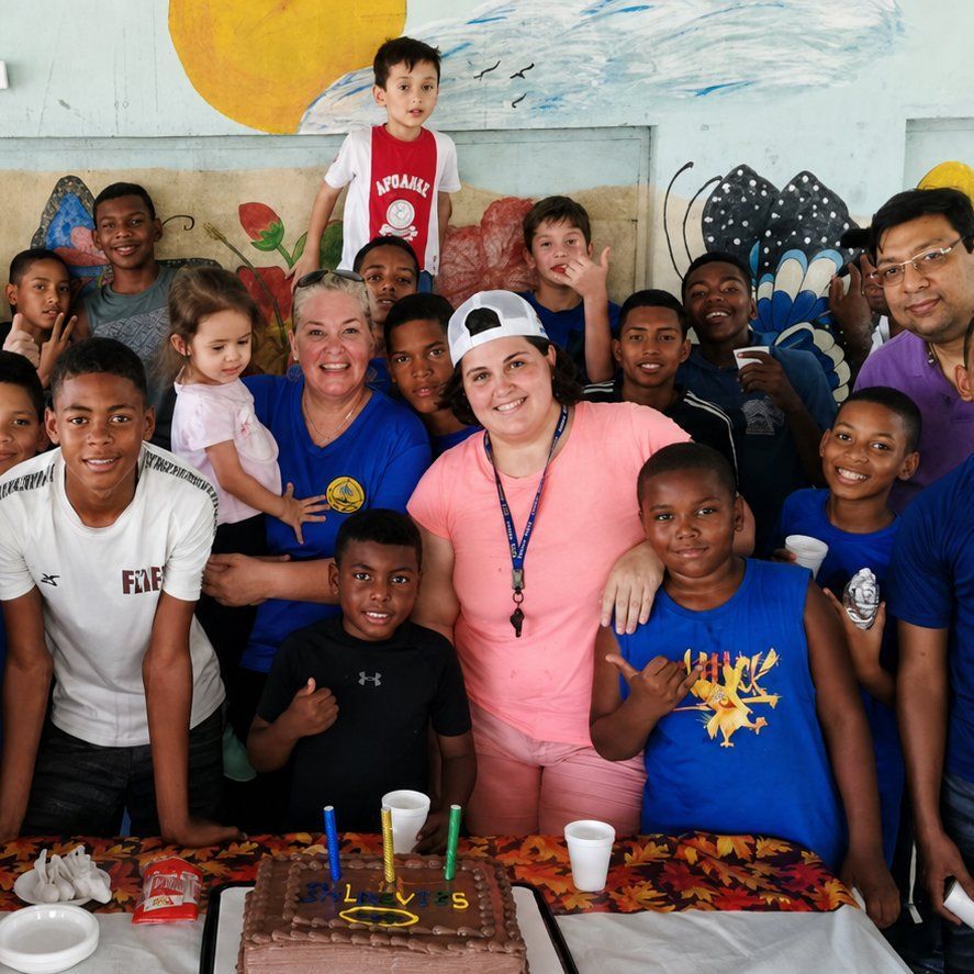 Children and adults gathering together in the community