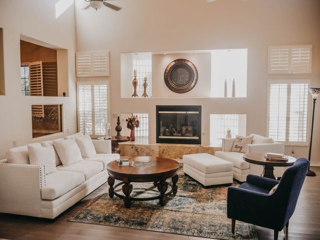 A living room filled with furniture and a fireplace.