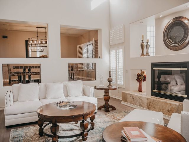 A living room filled with furniture and a fireplace.