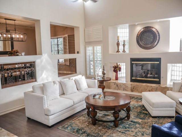 A living room filled with furniture and a fireplace.