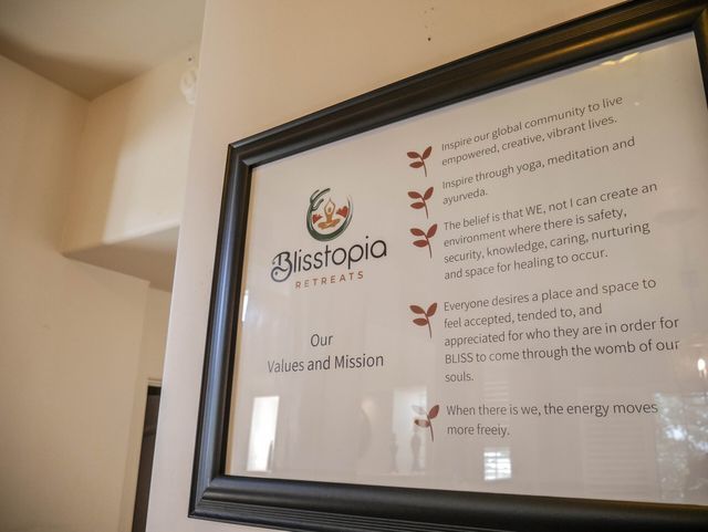 A framed piece of paper with blisstopia written on it