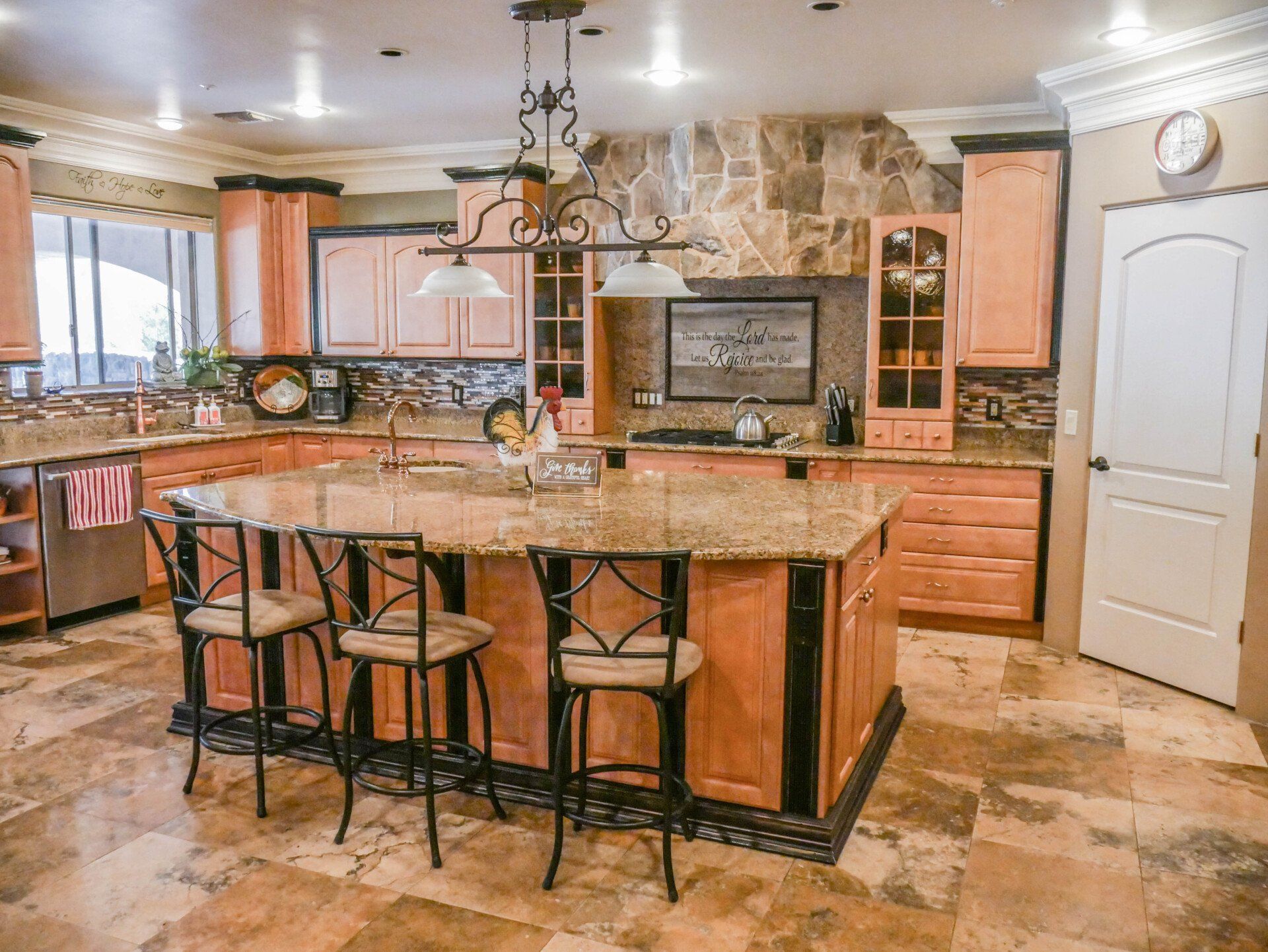 There is a large island in the middle of the kitchen.