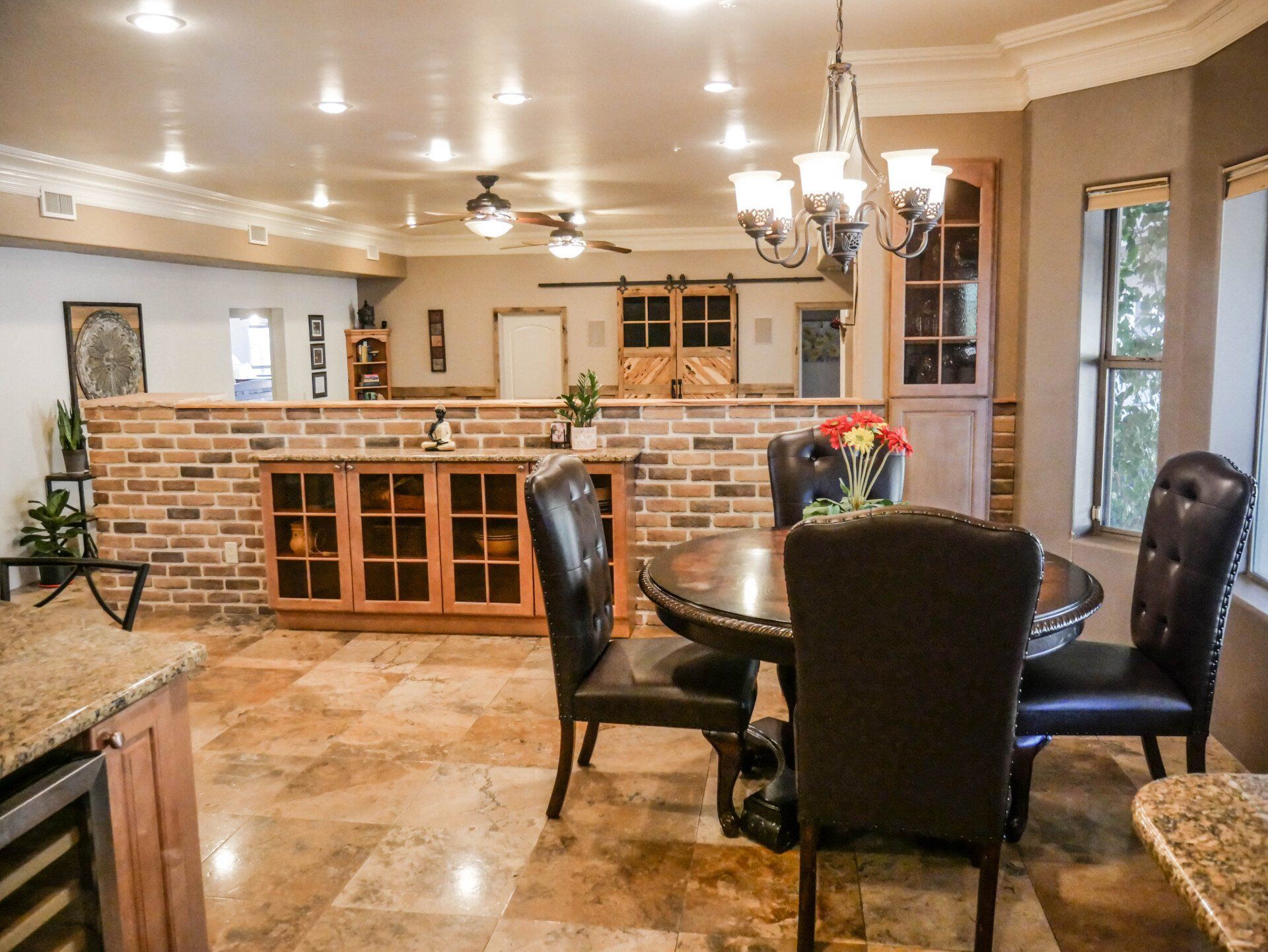 A kitchen with a table and chairs in it