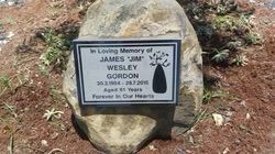 Grave marker on a stone. Reads 