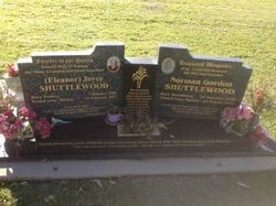 Gravestone of Eleanor Joyce and Norman Gordon Shuttlewood, with inscriptions and a tree emblem — Mackay Monumental Masons In Glenella, QLD
