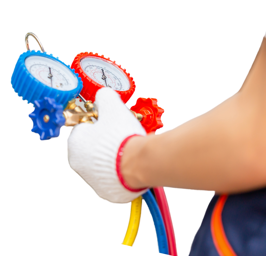 A person wearing a white glove is holding a blue and red pressure gauge