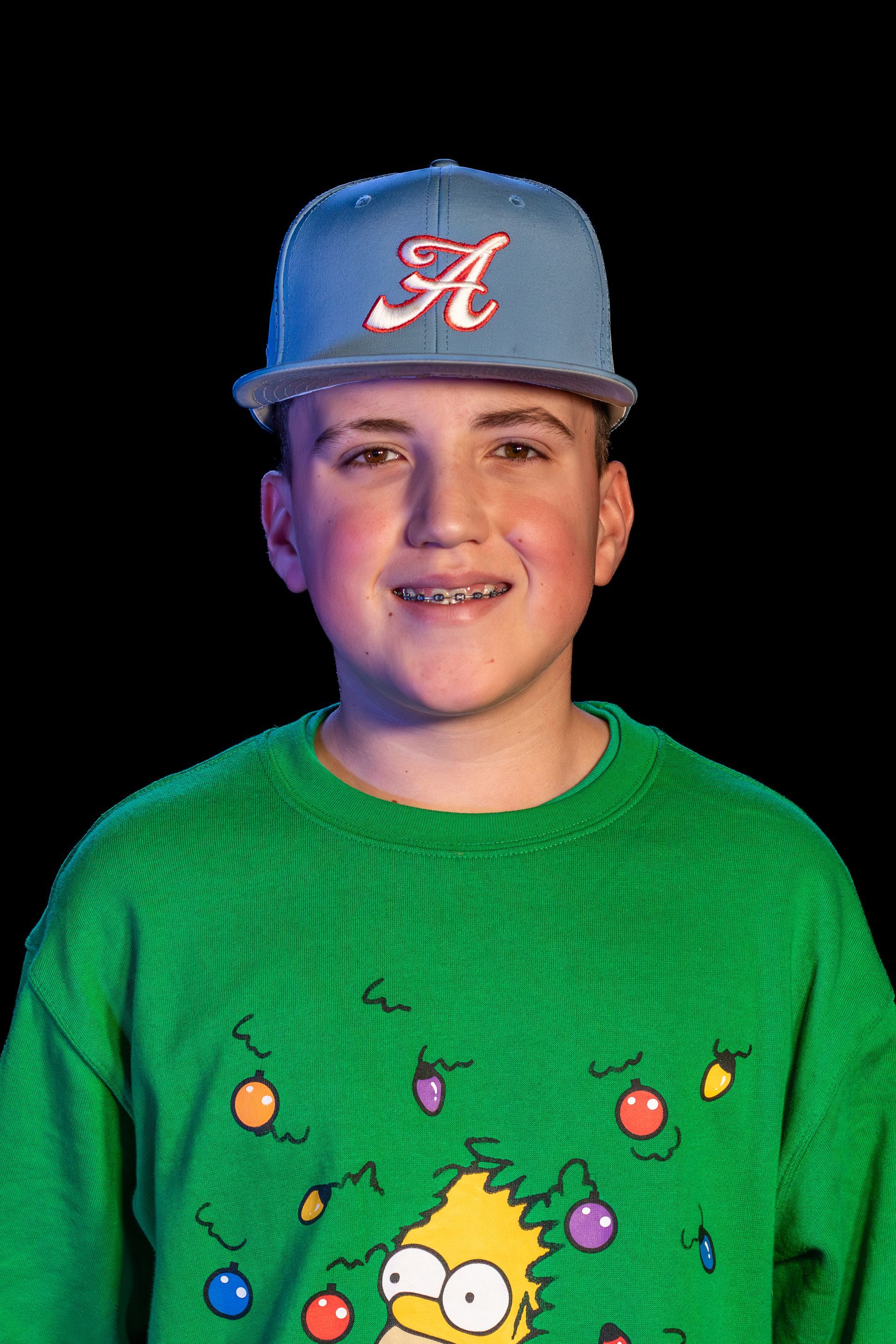 A person wearing a light blue baseball cap with an 