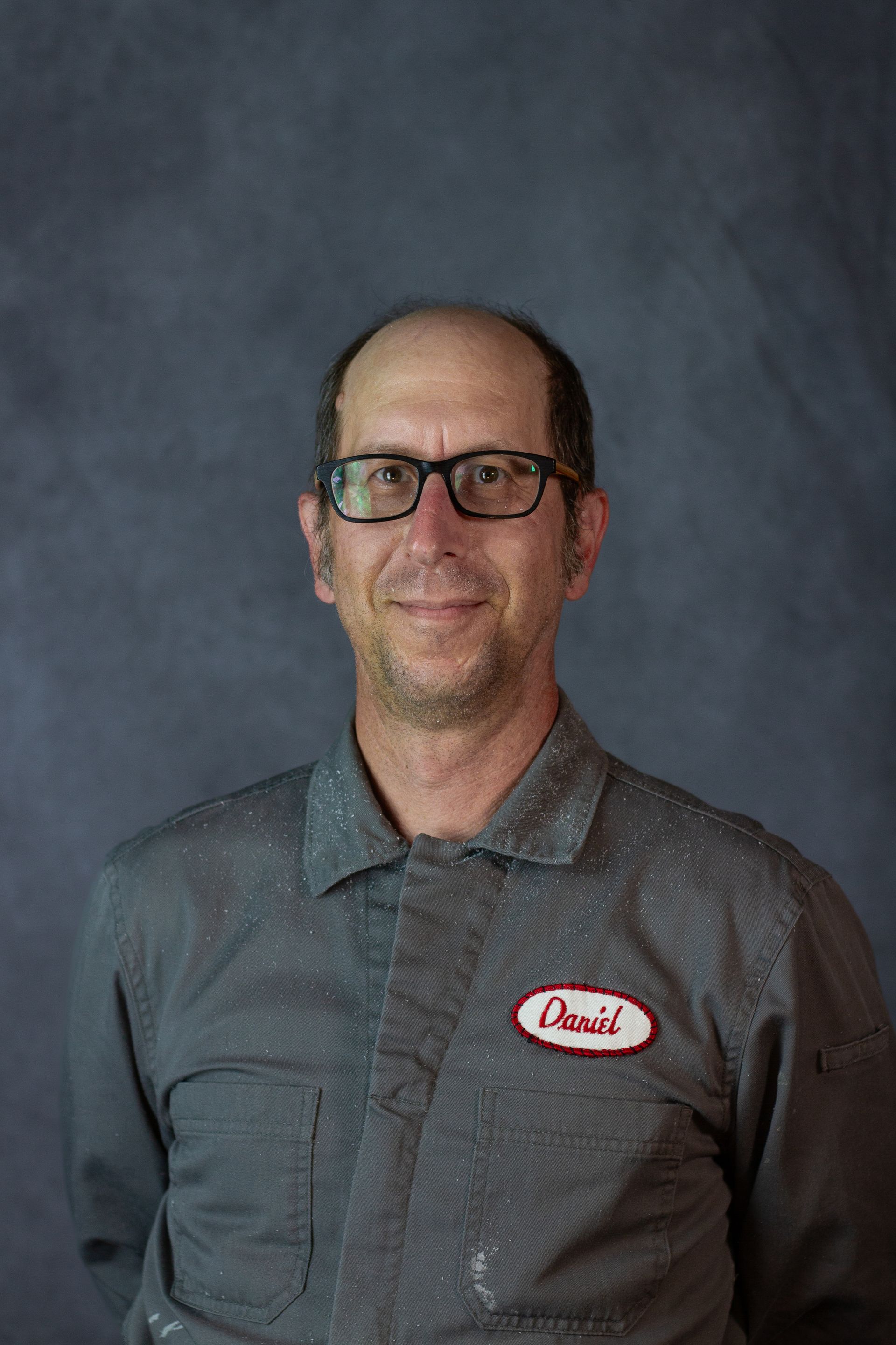 Man with glasses and the name tag