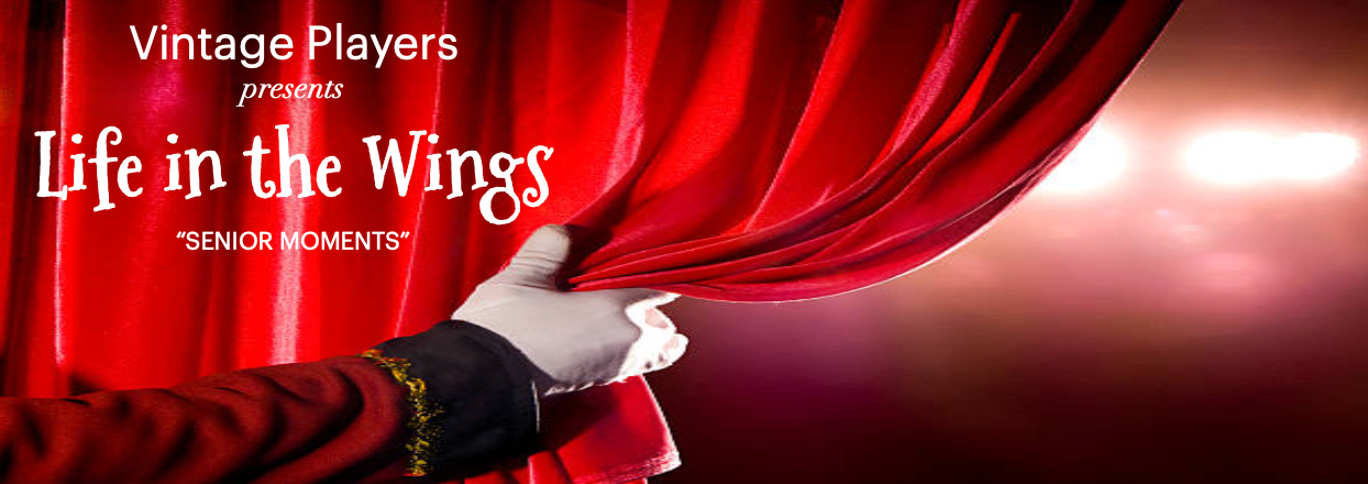 A hand pulls back a red theater curtain.