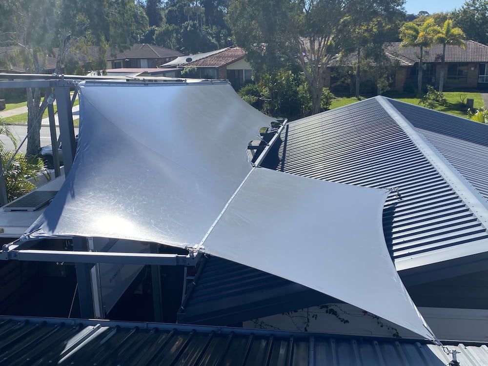 A Gray Roof With A White Shade On It — SPF Shades and Sails in Lismore, NSW