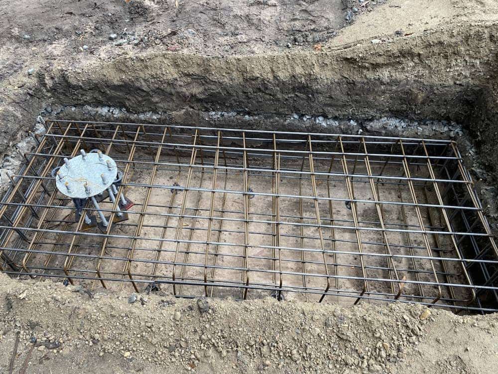 A Concrete Foundation Is Being Built In A Hole In The Ground — SPF Shades and Sails in Tweed Heads West, NSW