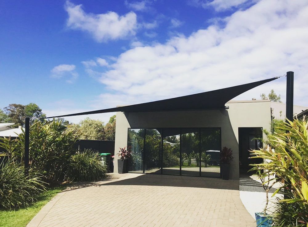 A House With A Shade Sail On Top Of It — SPF Shades and Sails in Tweed Heads West, NSW