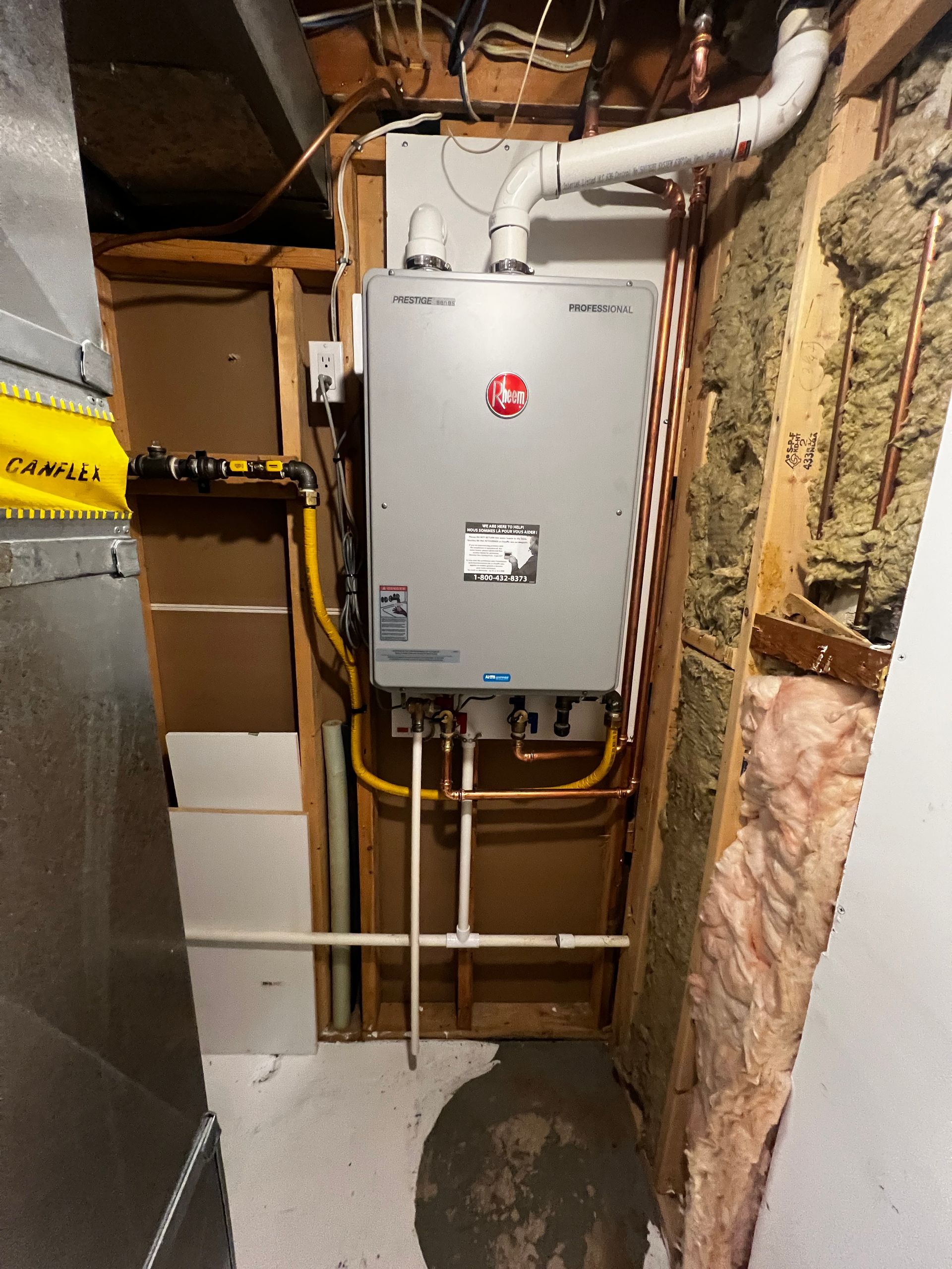 A water heater is installed in a basement in a house.
