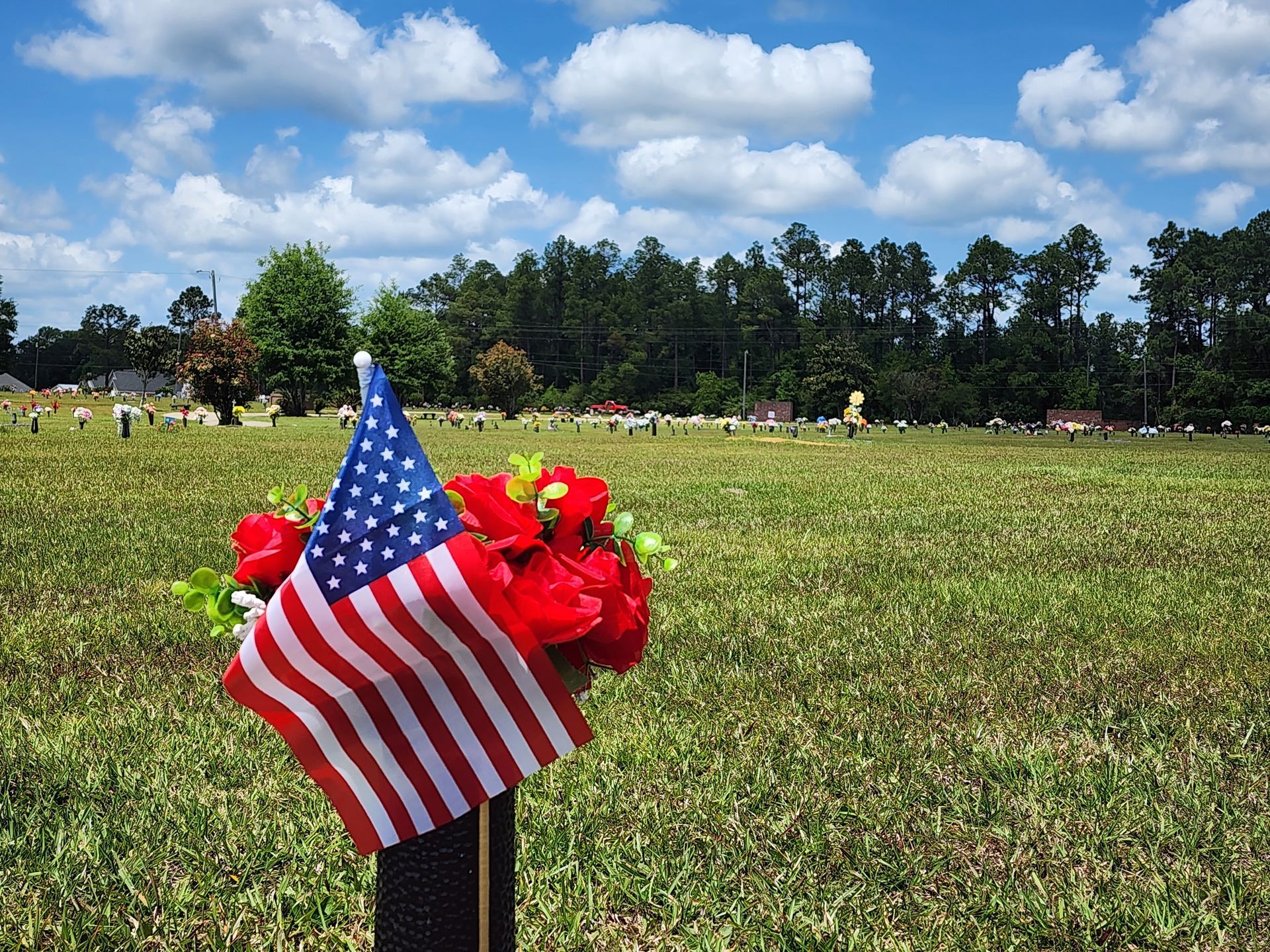 USA flag in cemetery headstone vase