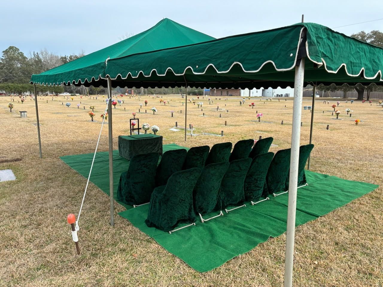 A cremation urn burial graveside setup can include 6 to 12 chairs.