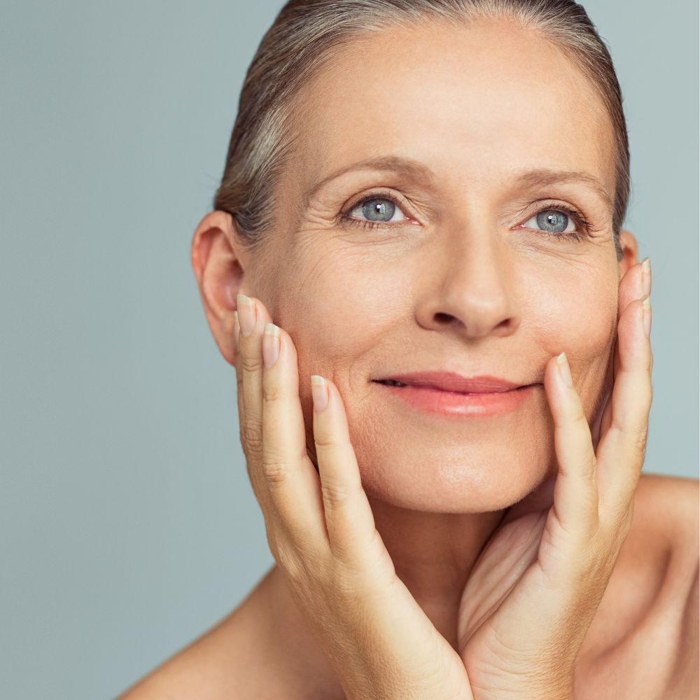 Mature skin being assessed for firmness and texture before an anti-aging plan