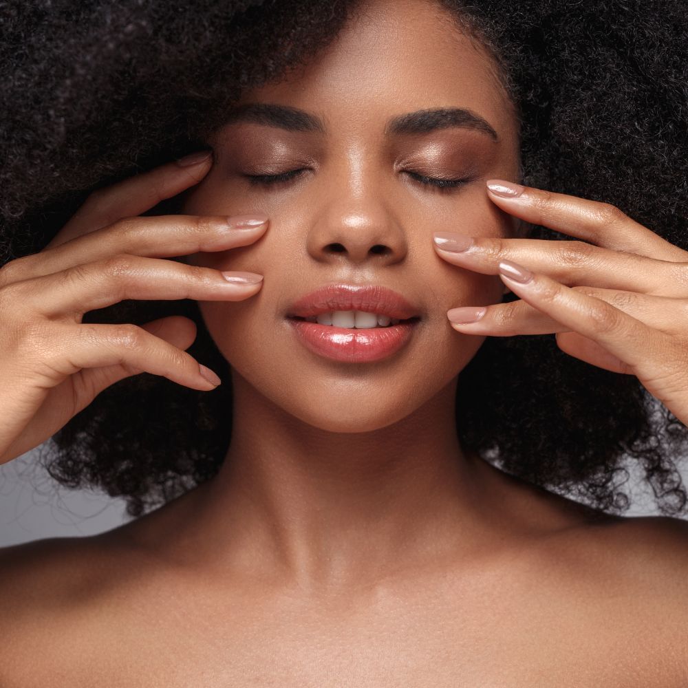 Collagen stimulating treatment being performed along the jawline and cheek