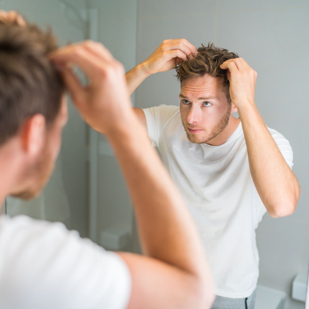 Regenerative treatment being delivered into the scalp during a hair restoration session