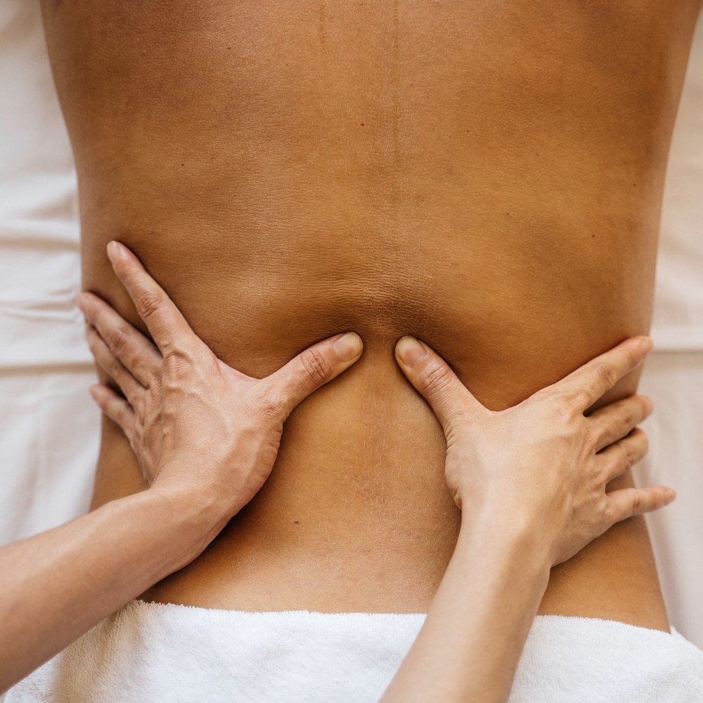 Clean treatment table prepared with fresh linen before a massage therapy appointment
