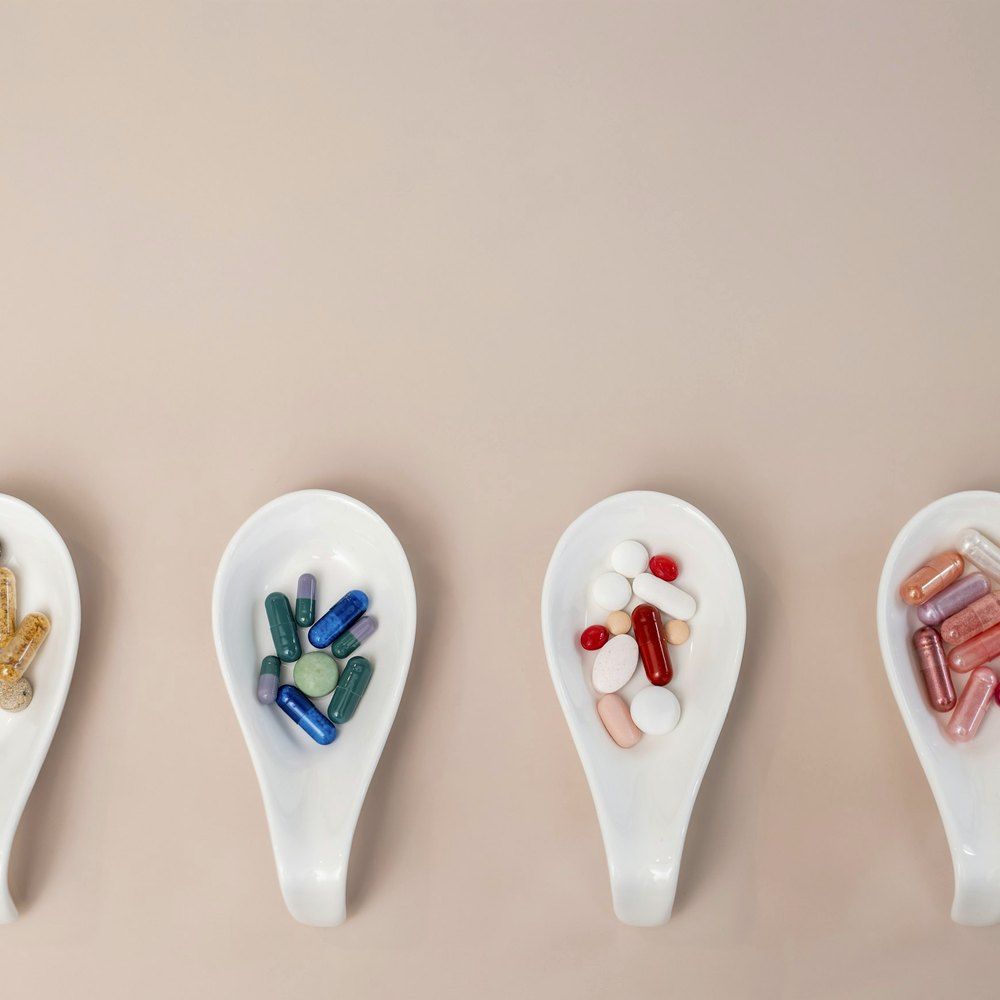 Prepared vials and syringes set out on a clean tray before a vitamin blend is mixed.