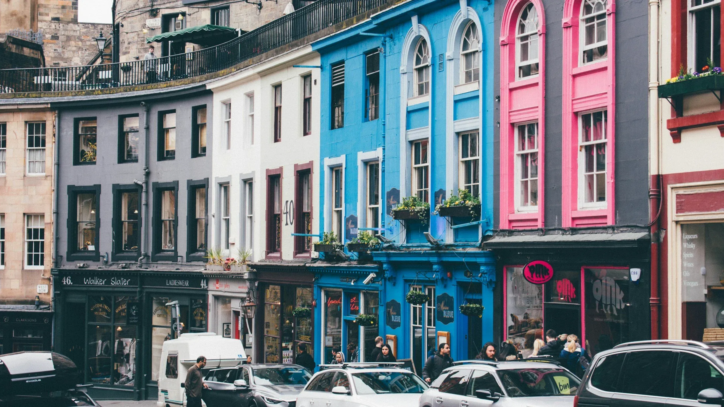 Victoria Street in Edinburgh, its coloured shopfronts curving up towards the Old Town