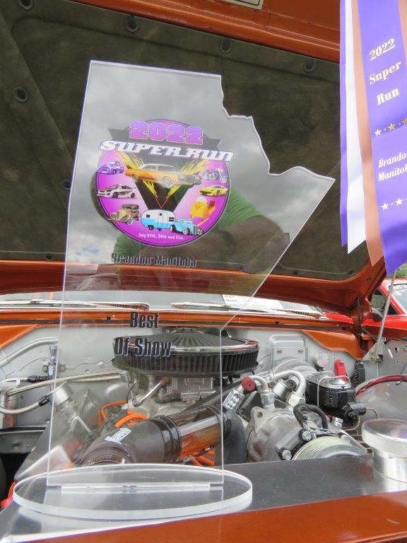 A super run sticker is on the hood of a car