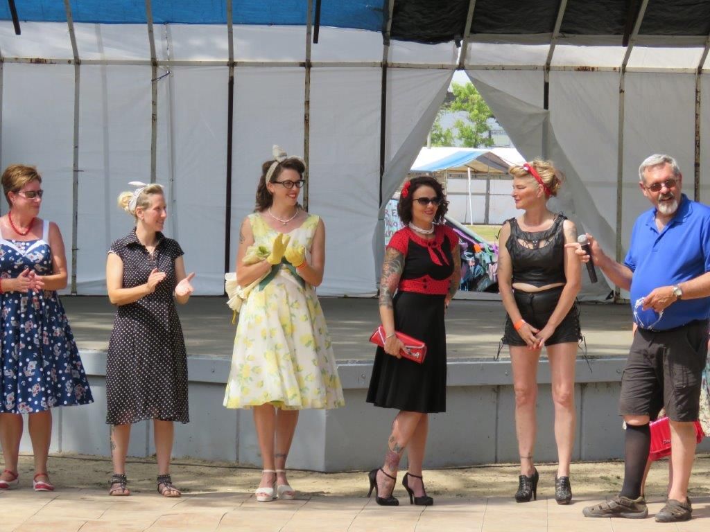 A group of women are standing next to each other on a stage.