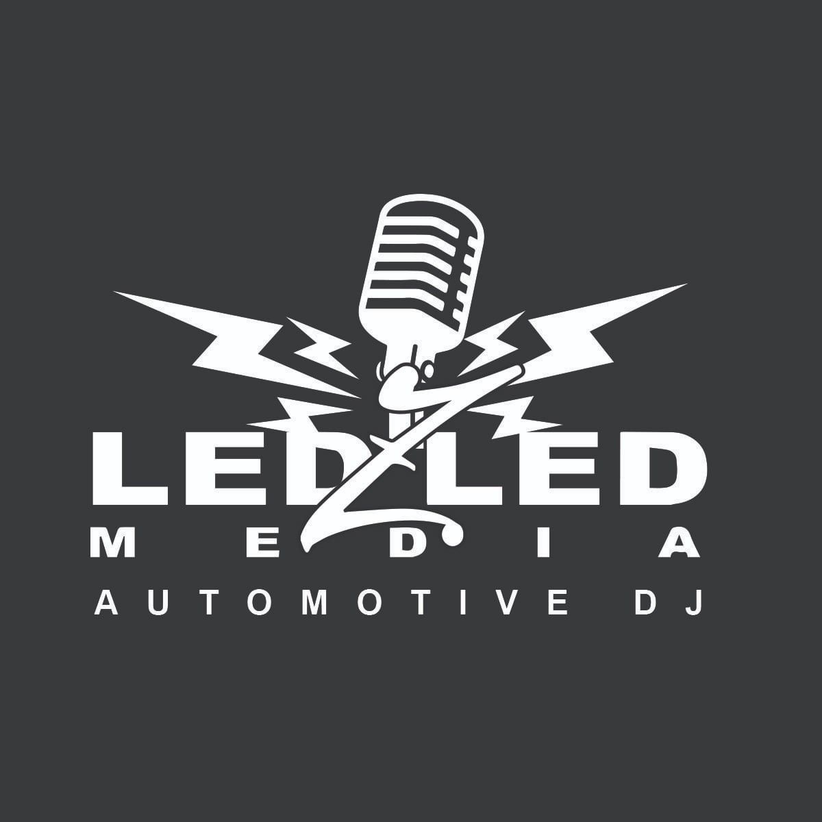 White logo on dark gray background featuring a microphone, lightning bolt, and the text