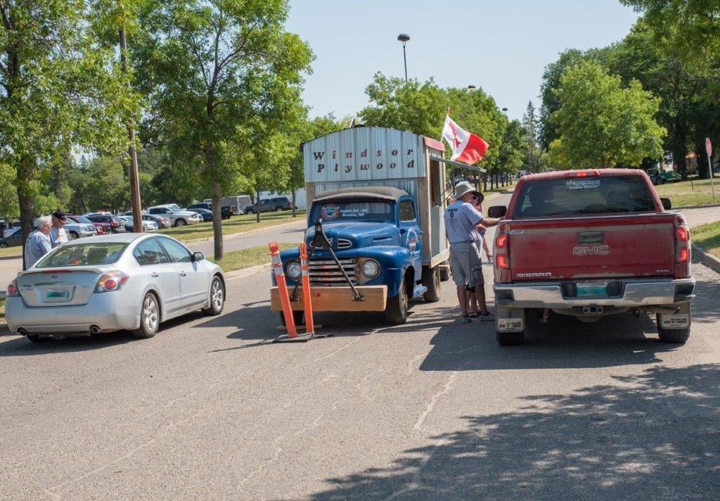 A red truck with the word gmc on the back