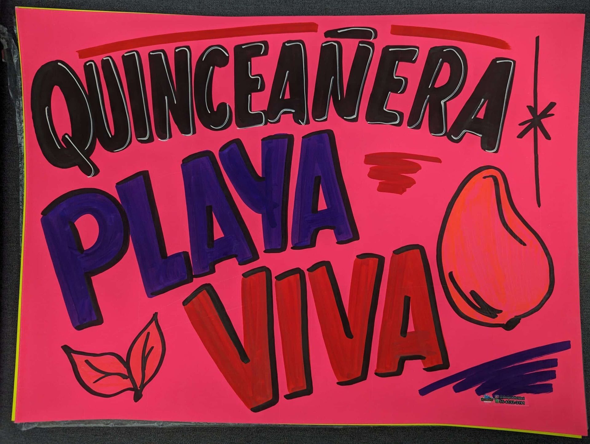 Quinceañera party sign in pink, purple, and red reading “PLAYA VIVA” with star and shell graphics
