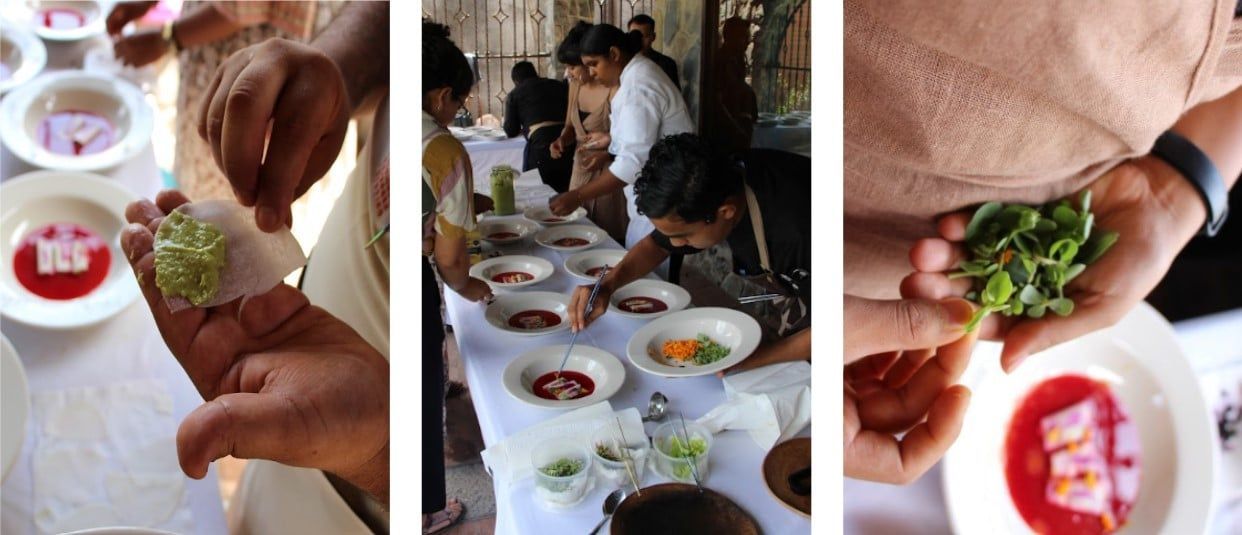 Hands scooping green garnish over plates of red soup at a buffet table