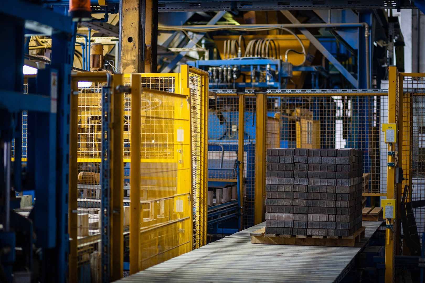A Warehouse Filled With Lots Of Bricks And Machinery — Wylec In Newcastle, NSW