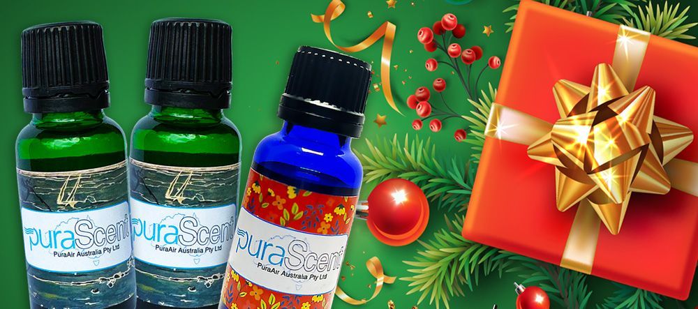 Bottles of essential oils with a Christmas gift.