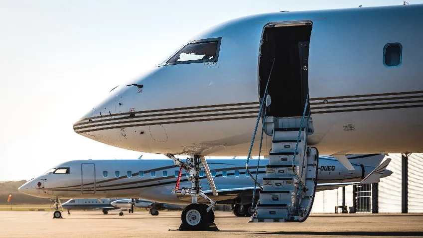 Business travellers boarding private jet for international flight from Australia
