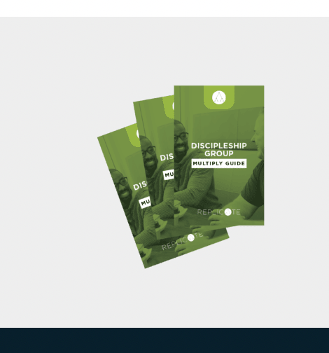 Three green pamphlets are sitting on top of each other on a table.